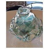 Freeform hand blown glass vase with sea glass inside. 4.75 in tall.