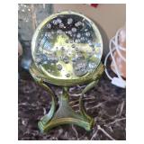 Clear glass orb with bubbles on stand. Total height 7.5 in tall.