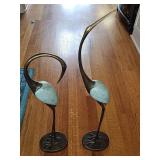 Pair of metal cranes. 29 in and 36 in tall.