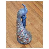 Copper and brass color peacock on column. 18.5 in tall