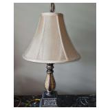 Traditional Urn Table Lamp in a two-tone bronze finish, featuring an urn-shaped cast-resin base, square pedestal foot, and a flared bell shade.20.5 in tall.