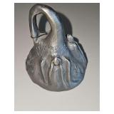 DeGrazia Pewter Bell Ornament featuring a sculpted angel relief design, signed by artist Marion DeGrazia. 3 in tall.