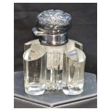 Heavy cut glass/crystal inkwell with silver top. Top is unmarked and nonreactive to magnet. 1 7/ x 1 7/8 x  2.75 in tall.
