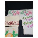 Pillowcases, placemat, and one painted pillowcase. Last four photos are of two table runners that are incomplete. See all photos.