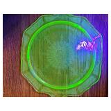 Footed uranium glass plate. 9.75-in diameter. Easel not included.