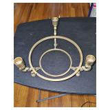 Solid brass candelabra with opening for a bowl or floral arrangement. 8.5 in diameter