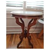 Antique oval marble top table. 22 x 18 x 27 in tall.