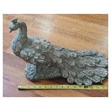 Peacock resin figurine.