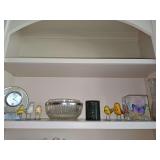 Shelf contents. Danbury desk clock, two vases, covered jar, birds, fruit bowl.
