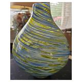 Murano style studio art glass vase featuring a bulbous, teardrop shape with a swirled pattern of blue, yellow, and white threads. 11 in tall. Sticker residue as shown.