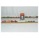24 vehicles & trailers: 10 Barclay, 6 Tootsie Toy,