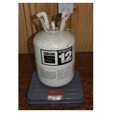 Sercon Refrigerant 12, tank weighs 32 lbs; as is