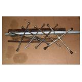 Lot: 4 star wrenches, pipe and stakes; as is