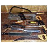 13 various saws and a Sheffield machete
