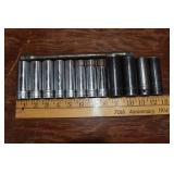 12 Snap-On 1/2" sockets mostly SAE and 10" extensi
