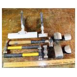 Collection of metal shaping hammers and other tool
