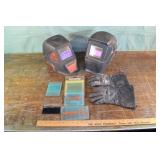 2 welding helmets, lens covers and gloves; as is