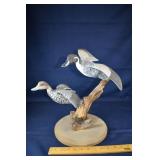 Pair pintail decoys in flight mounted on a driftwo