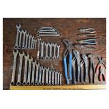 33 combination wrenches, 10 pliers; as is