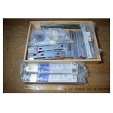 Collection of assorted drawer slides; as is