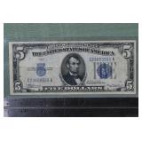 Series of 1934 US $5 blue seal Silver Certificate;