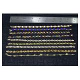 Marked 14 kt gold jewelry: 9 tennis bracelets set