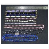 Marked 14 kt gold jewelry: 3 necklaces and 7 brace