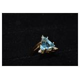 14 kt gold ring set with 10mm trillion cut topaz a