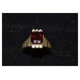 14 kt gold ring set with 6x9mm garnet and 6 accent