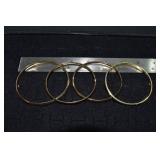 Marked 14 kt gold jewelry: 4 hinged bangle bracele