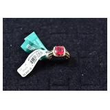 14 kt gold ring set with cushion cut lead glass fi