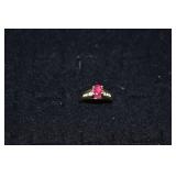 14 kt gold ring set with 5x7mm oval ruby & 10 diam