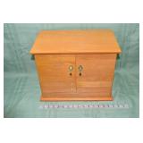 Oak finish jewelry cabinet with mirrored lid and h