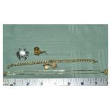 Marked 14 kt gold jewelry: charm bracelet, crab pi