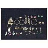 14 kt gold pendants and earrings set with stones,