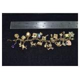 Marked 14 kt gold jewelry: charm bracelet with 21