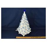 White ceramic illuminated Christmas tree with blue