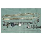 Sterling silver charm bracelet with charms, silver
