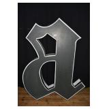 Metal illuminated "a" which was part of the Baltim