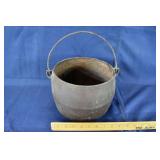 9" cast iron stew pot with bale handle; as is