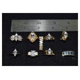 Marked 14 kt gold jewelry: 9 rings set with clear