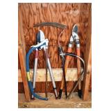 Tool lot: 2 saws, 2 loppers, sickle; as is