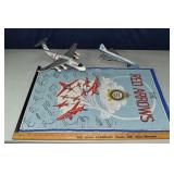 2 metal airplane models and a textile banner; as i