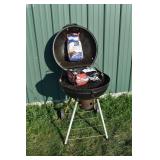 UniFlame charcoal grill and 2 bags of briquets; as
