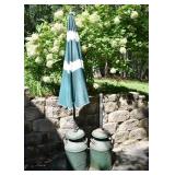 2  re-purposed milk cans and a patio umbrella; as