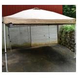 First-Up 10x10 outdoor shelter with tattered top;