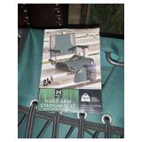 Hard arm stadium seat