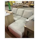 L-shaped upholstered grey sofa-dirty