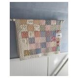 Quilt  hanging on wall