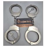 Pair of Handcuffs w Keys - Pearless, one marked